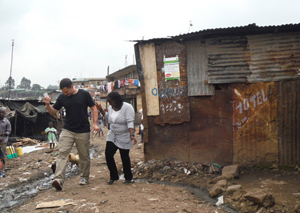 Zev Thompson in a slum. Photo credit: Gabe Mott, taken in Mathare, Nairobi, Kenya.